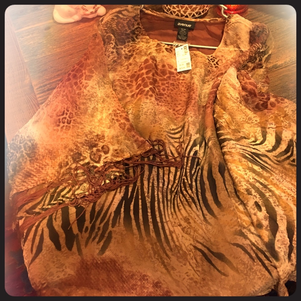 Avenue poncho in a animal print.