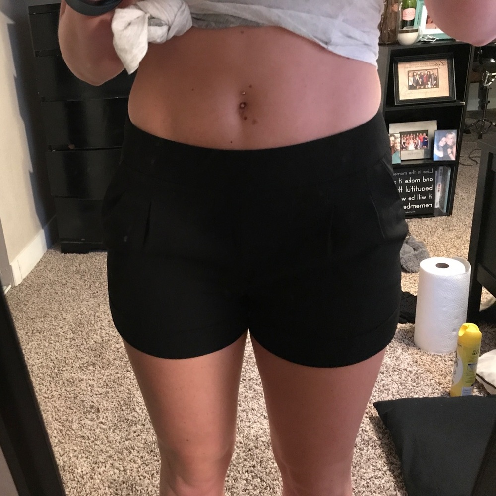 Never worn, polyester pleated dress shorts