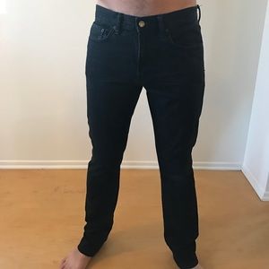 Men's black vintage wash jeans.