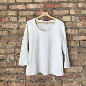 White floral quarter-sleeve top.