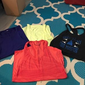 Four Under Armour Tank Tops