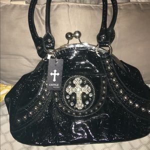 Brand new with tags clam shell style hand bag