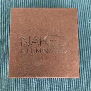 Urban Decay body illuminator in "Lit"