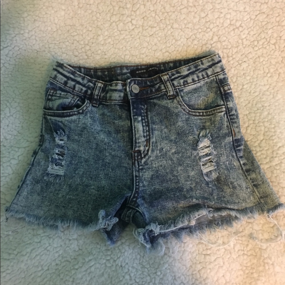 Distressed blue jean shorts