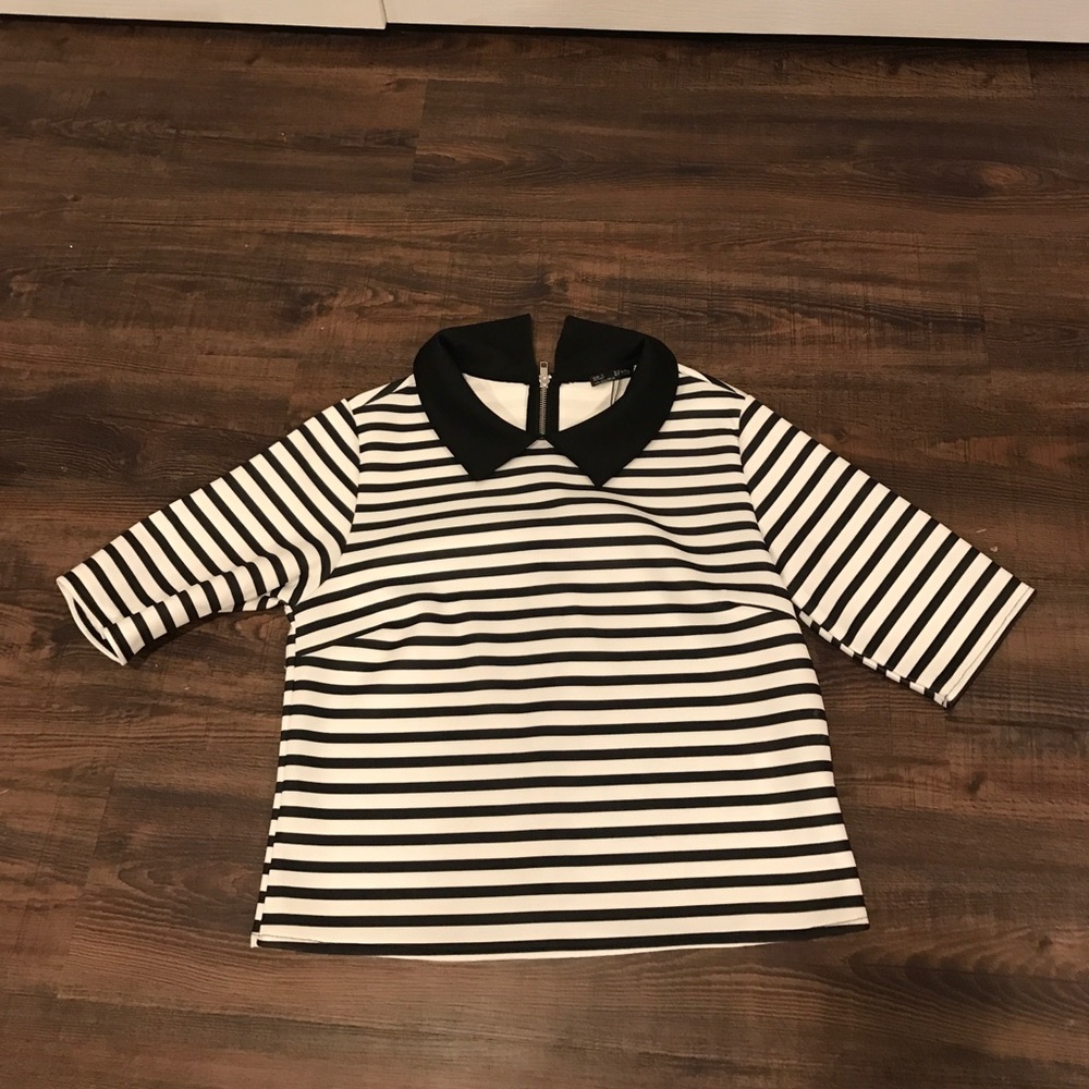 Cute black and white striped top. Never worn!
