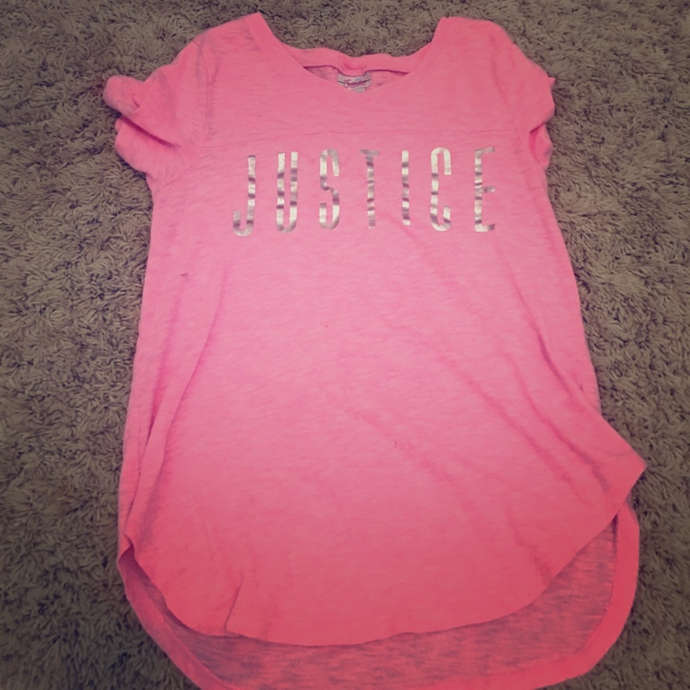 A pink shirt that says justice