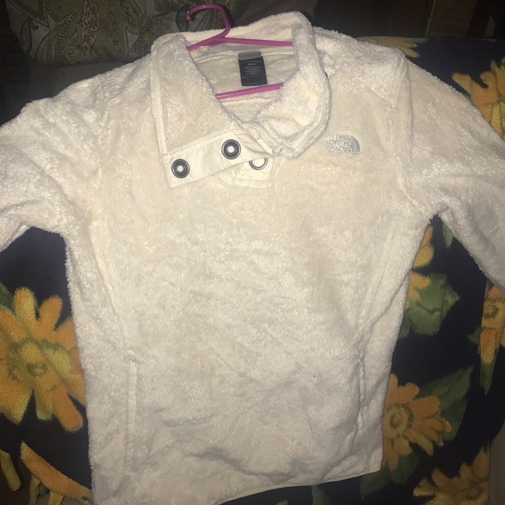 White fuzzy north face pull over