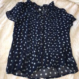 Ruffled polka dot shirt.