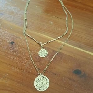 Gold toned mandala cutout necklace