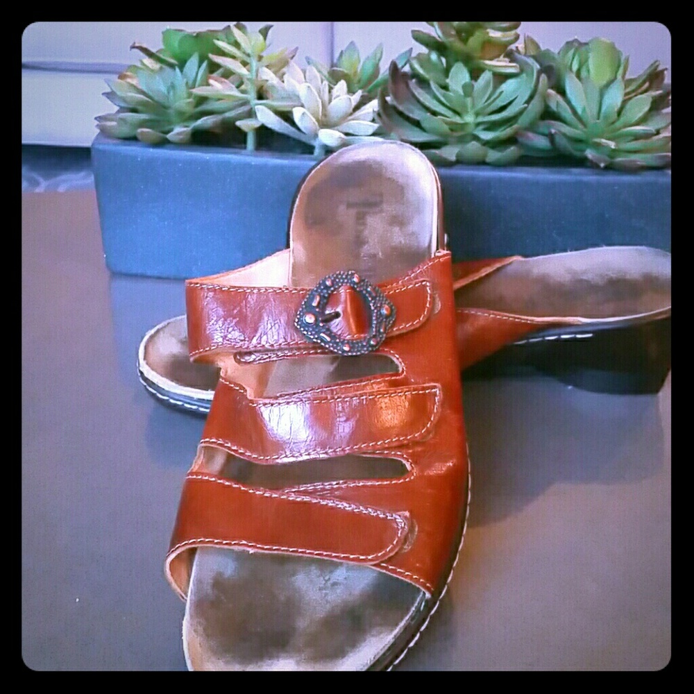 "Think " brown sandals.