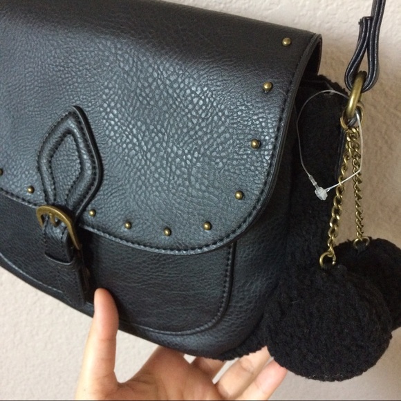 Carlos Santana Handbags - 🎉HP🎉 NWOT Carlos Santana pom pom crossbody bag