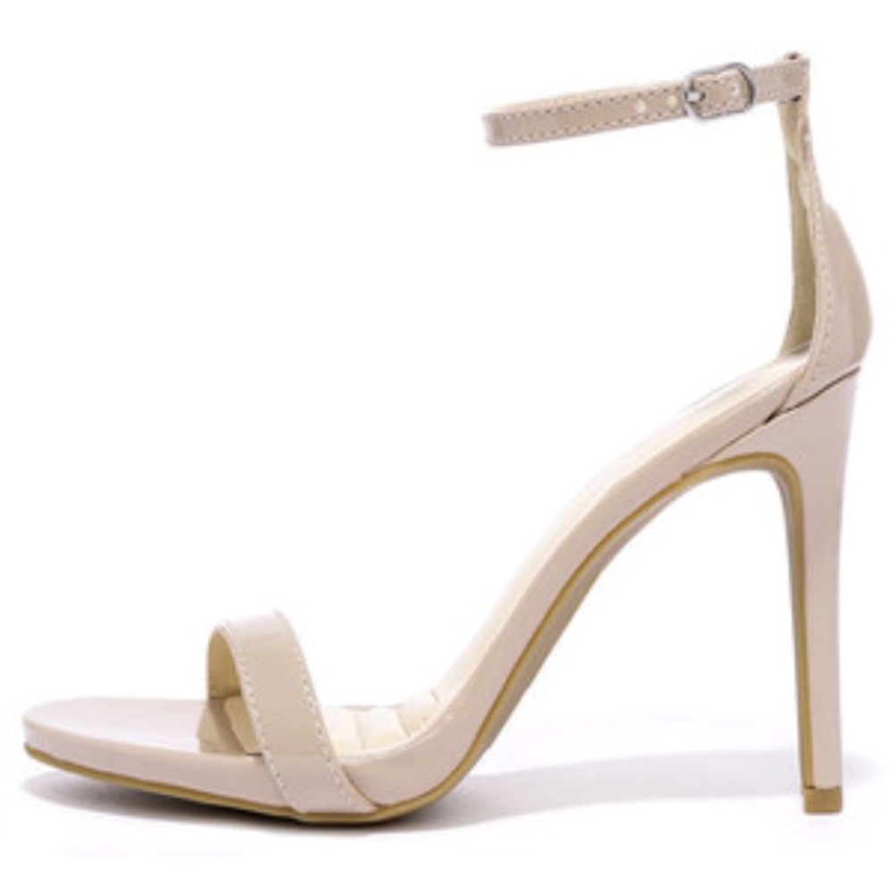 Nude patent ankle strap heel.