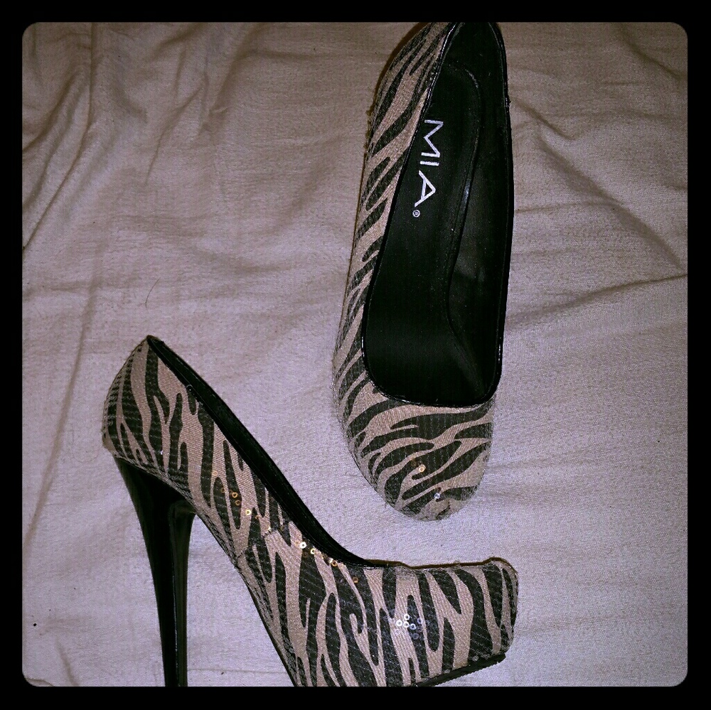 Never been worn designer pumps