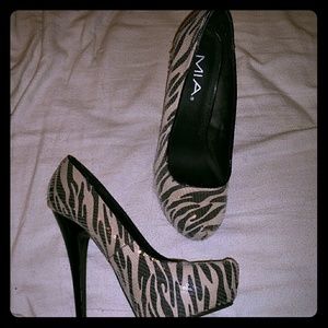 Never been worn designer pumps