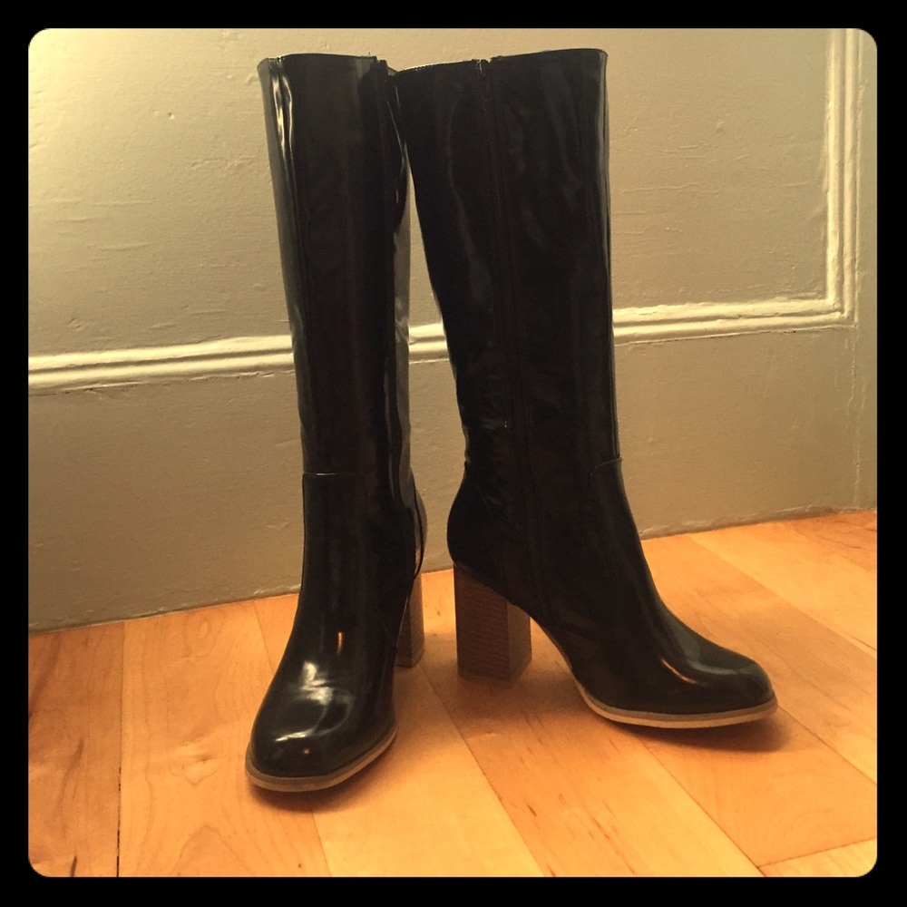 Never been worn, faux leather heeled boots.