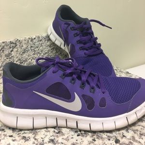 Purple Nike running shoes