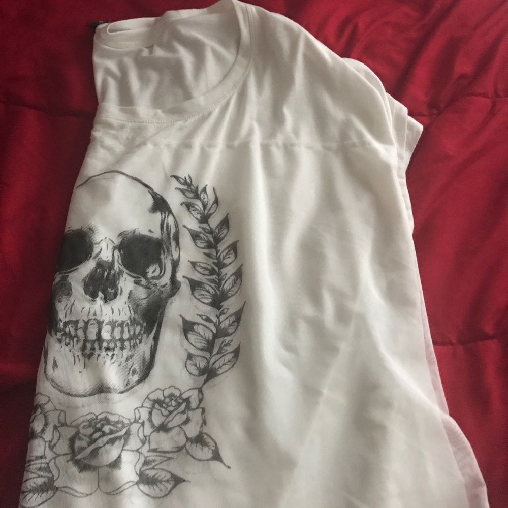 All white sleeve shirt with skeleton on the cover