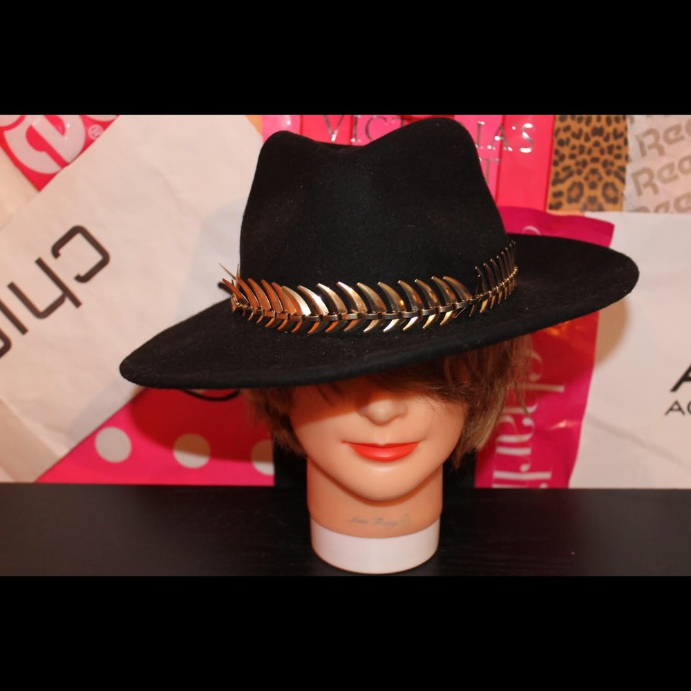 black floppy hat with gold trim