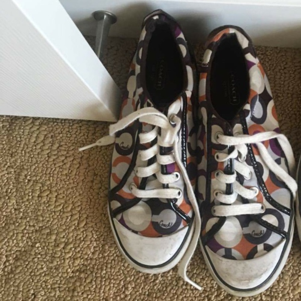 Dirty worn coach tennis shoes