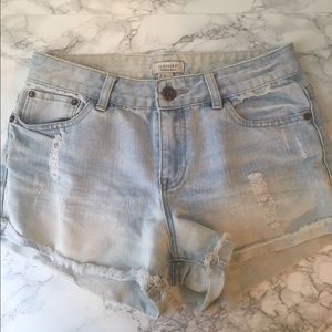 Light wash shorts with rips
