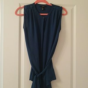 Dark green sleeveless blouse with enamel buttons