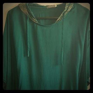 Turquoise poncho with gold embellished hood
