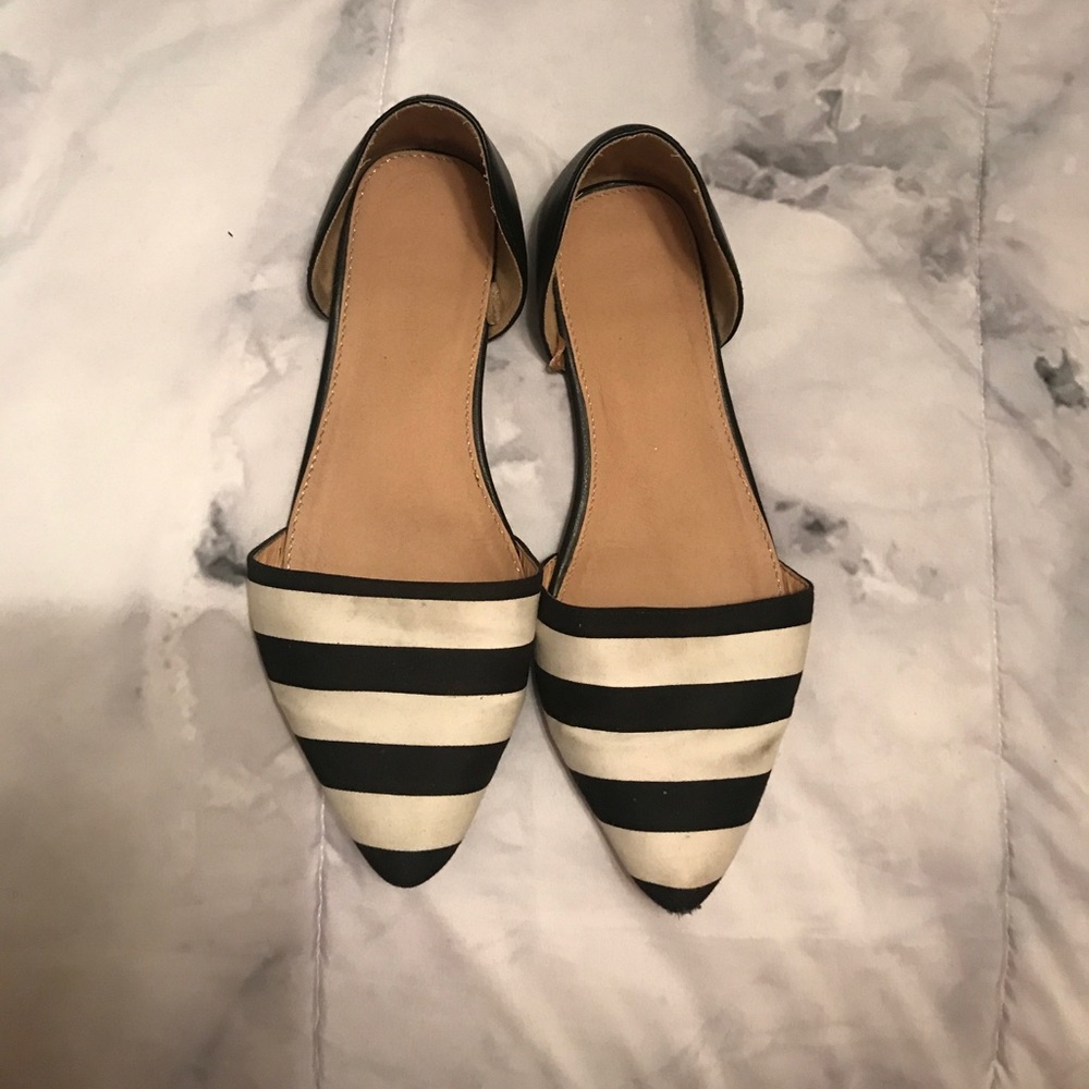 Black and white pointed toe slip on shoes