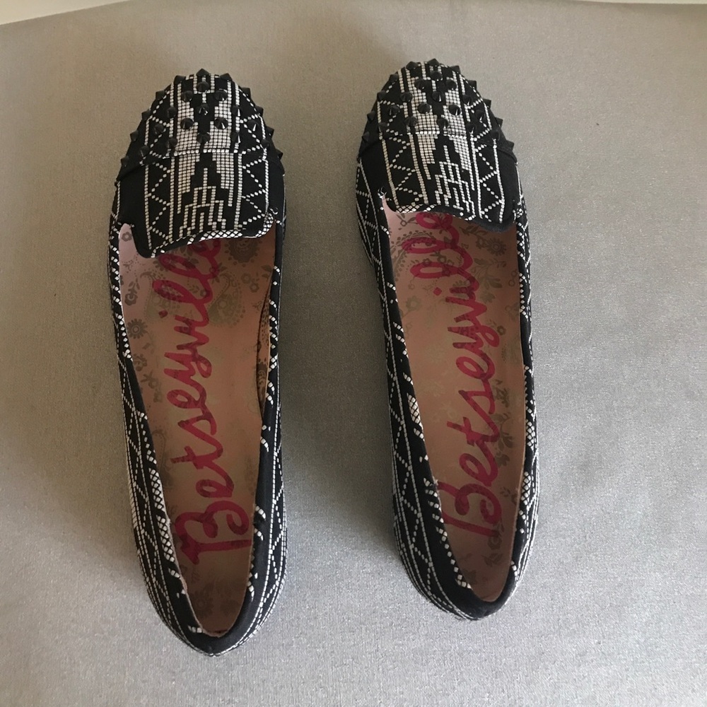Black and white with black studs on toe
