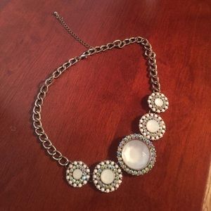 White stone necklace.