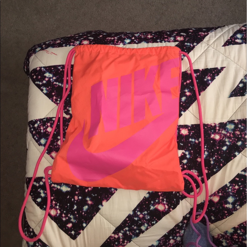 Orange and pink Nike string backpack