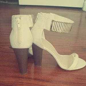 Open toe sandle with heel. Worn once around house