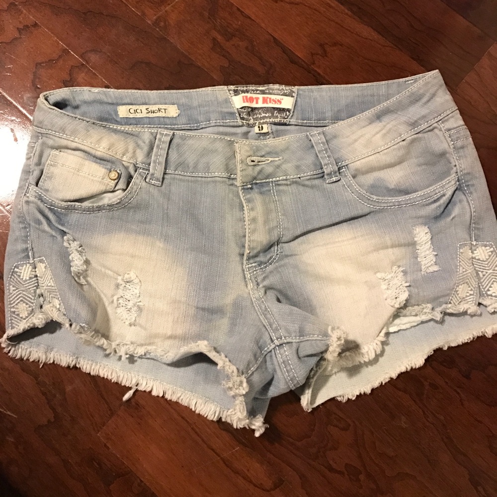 Tribal print and rip denim shorts