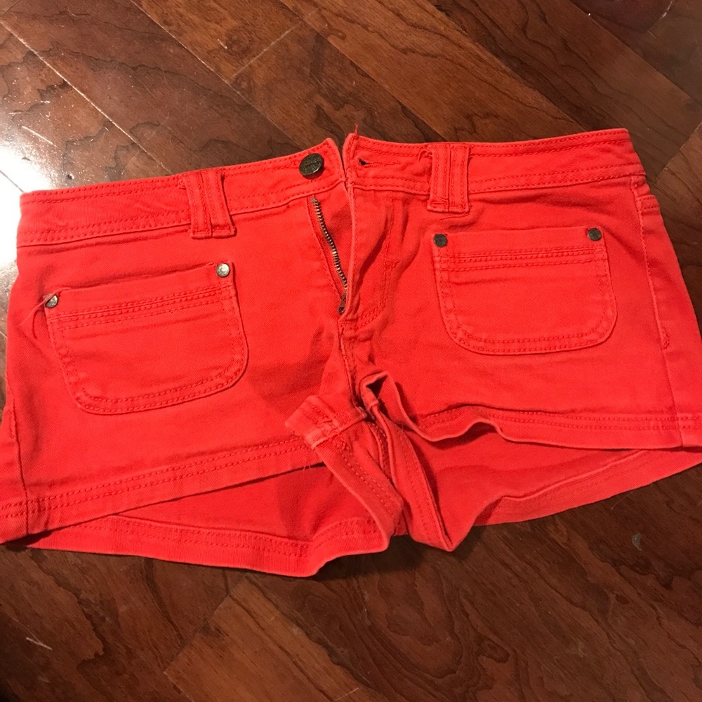 Red shorts (CONTAINS SMALL STAIN)