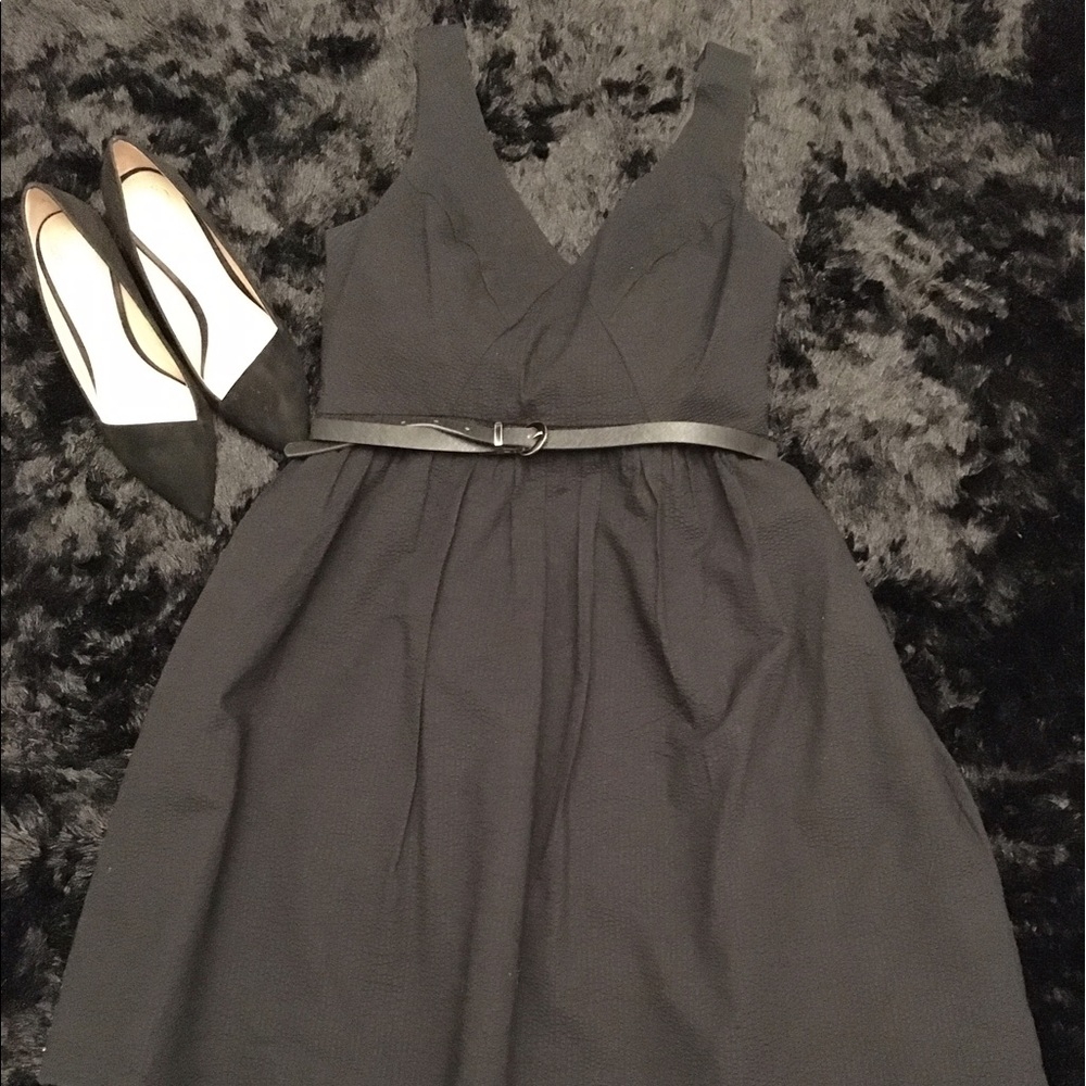 Oleg Cassini- Cute with hidden front pockets.