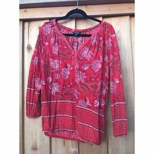 Red blouse with flower designs