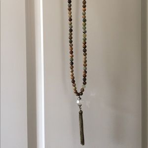 Long beaded necklace with tassel