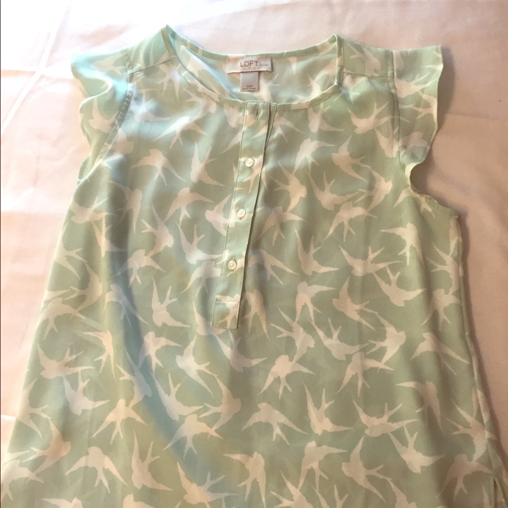 Cap sleeve blouse.