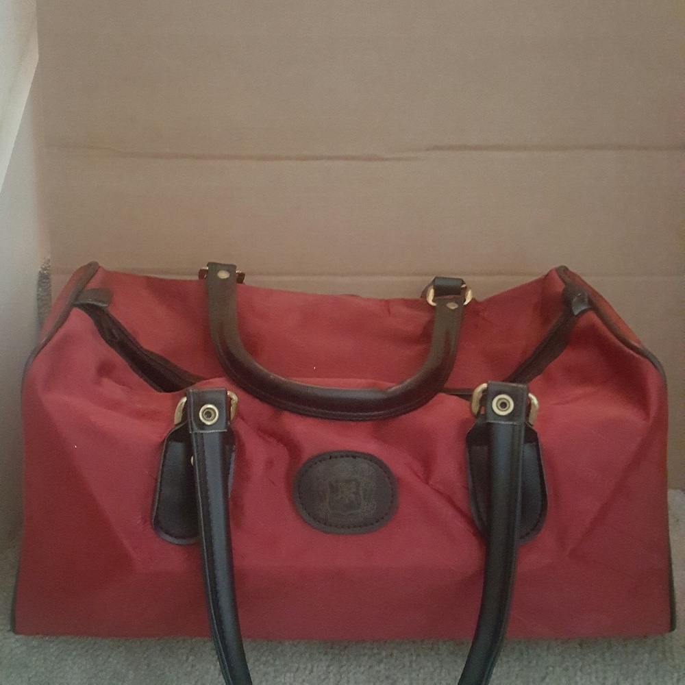Burgundy duffle bag