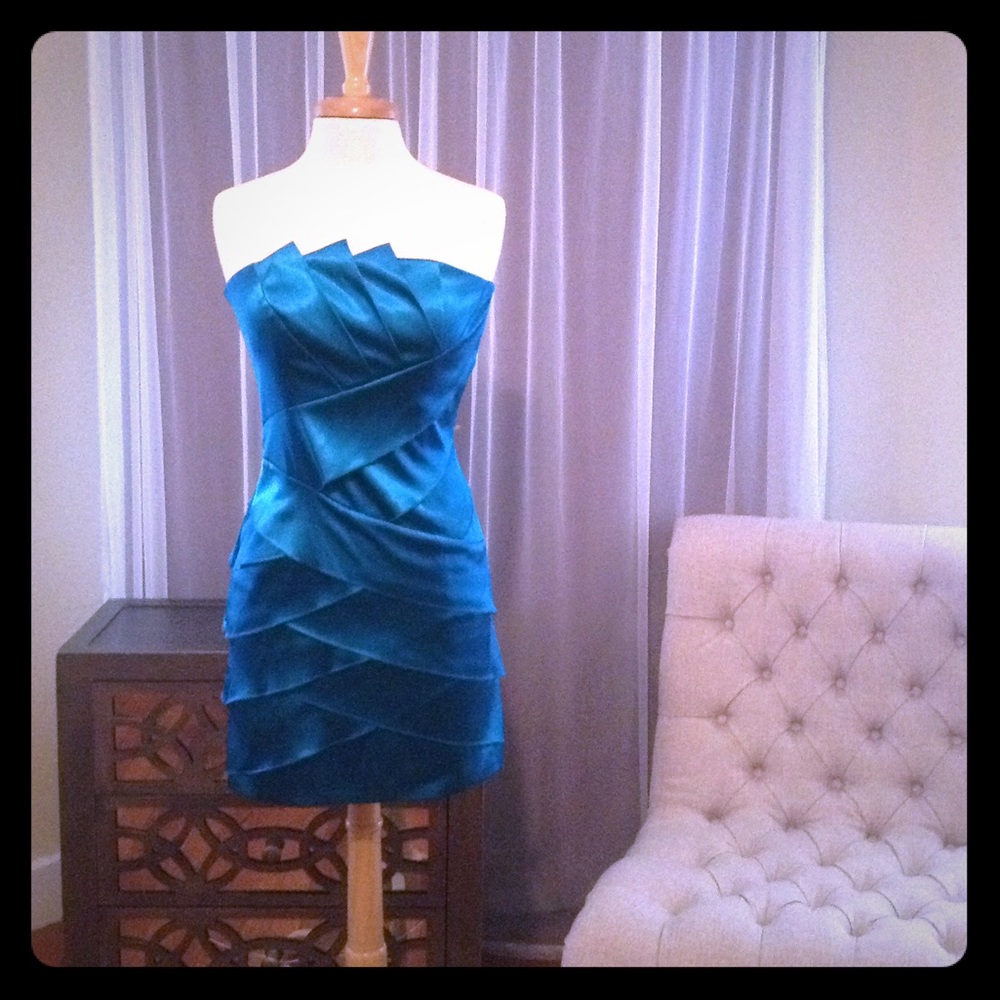 Bright blue satin tiered cocktail dress.