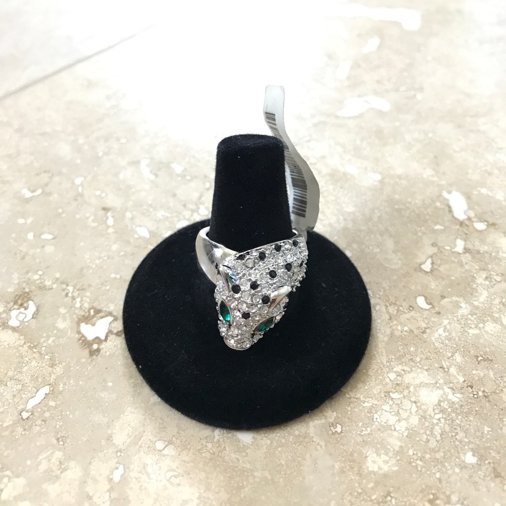 Silver pave leopard ring with green eyes