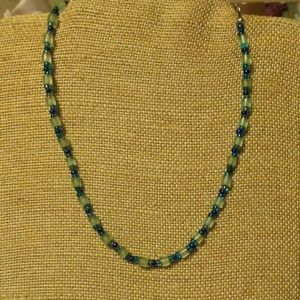 Necklace teal blue and frosted beads. 16 inches