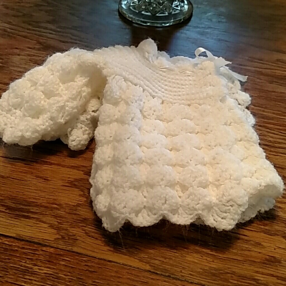 White hand knit infant sweater