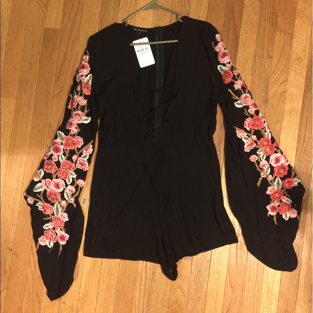 Lace up neck bat wing sleeve romper