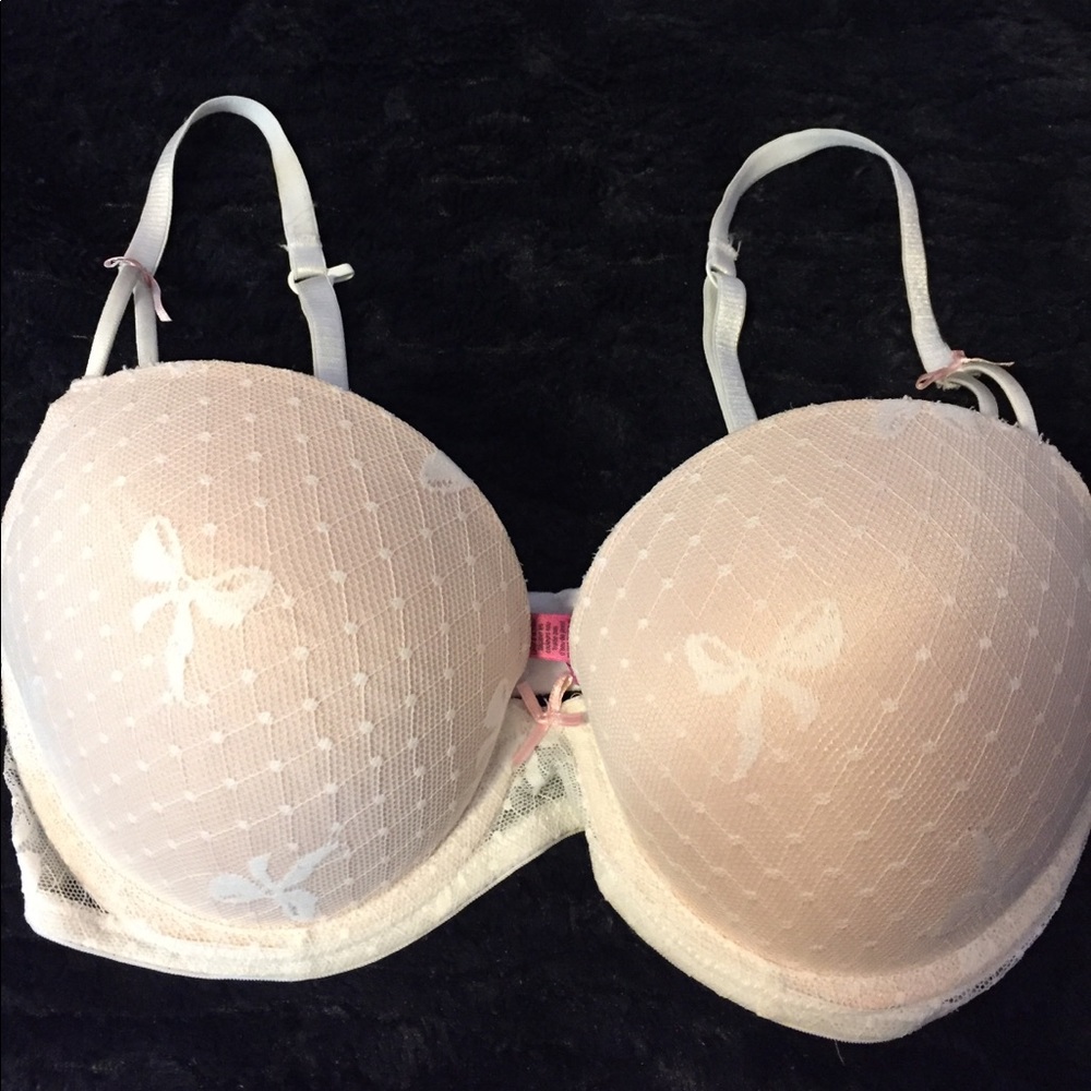 A white and pink 34C padded bra