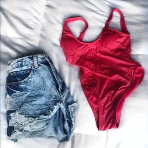 Bright red swoop back one piece NEW WITHOUT TAGS