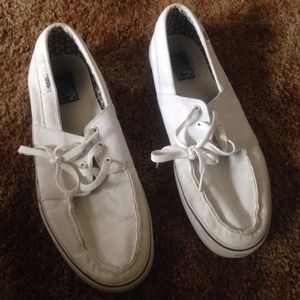 Vans white boat shoes.