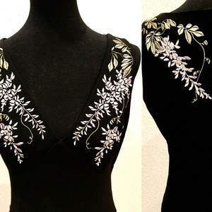 Dress with sewn floral design