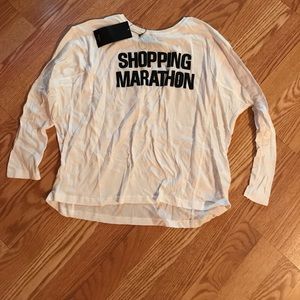 Long sleeved white top.