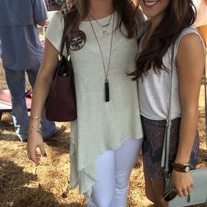 Cream colored short sleeve shirt with fabric tie