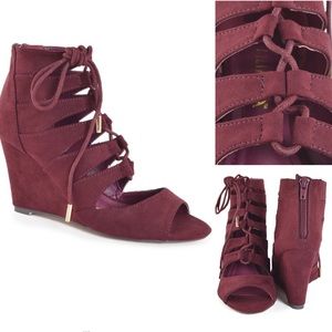 Modern peek-a-boo open vamp wedge ankle boot.